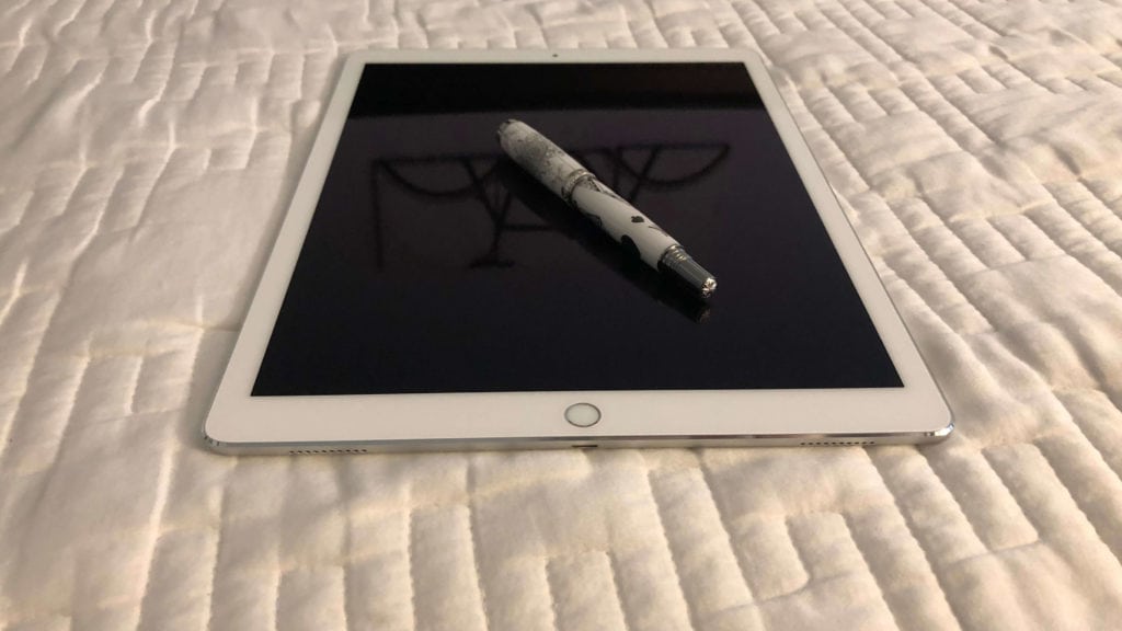Pen on iPad on bed
